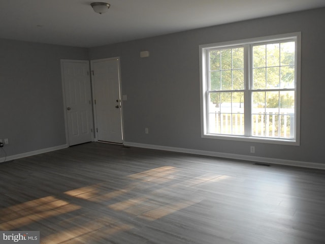 6271 Solomons Cir, Hurlock, MD 21643 - unfurnished room featuring healthy amount of natural light, baseboards, and wood finished floors