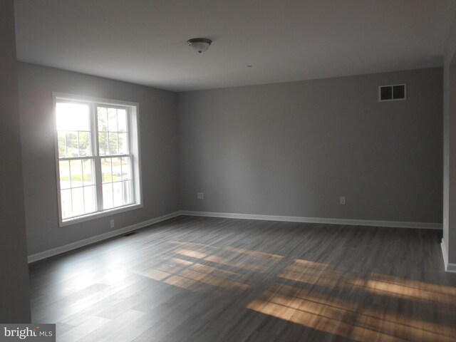 6271 Solomons Cir, Hurlock, MD 21643 - unfurnished room featuring dark wood-style floors and baseboards