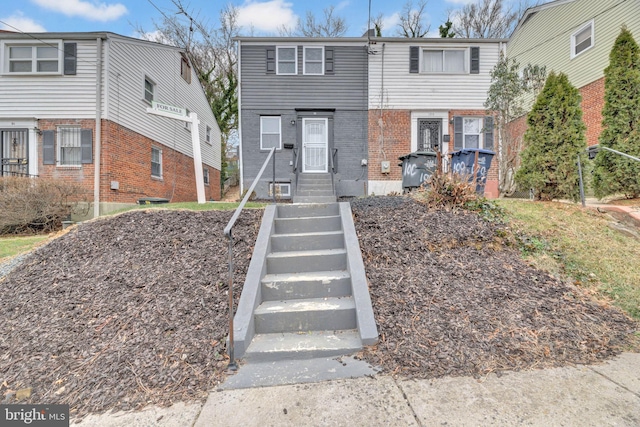 view of front of home featuring brick siding