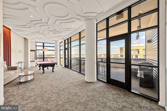 rec room with pool table, carpet, coffered ceiling, and expansive windows