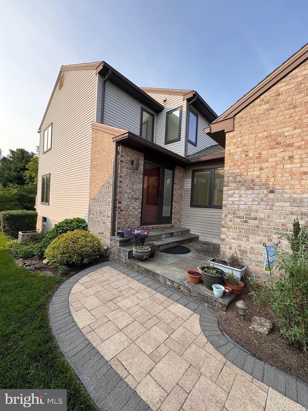 234 Steeplechase Cir, Wilmington, DE 19808 - property entrance with brick siding and a patio area