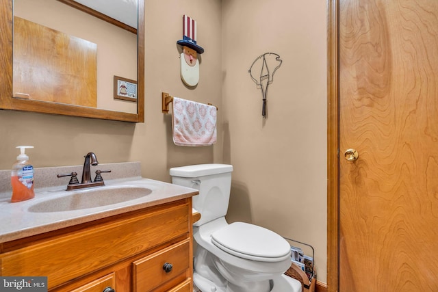 half bath with vanity and toilet
