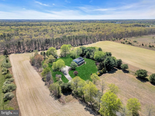 birds eye view of property with a rural view and a forest view