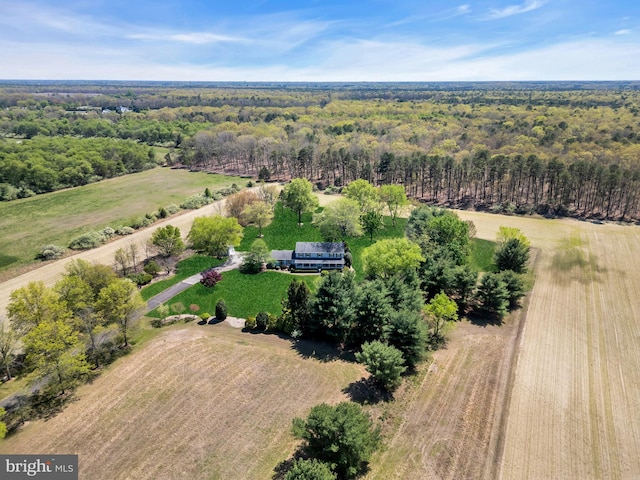 drone / aerial view with a rural view and a forest view