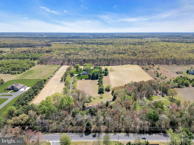 drone / aerial view with a rural view and a forest view