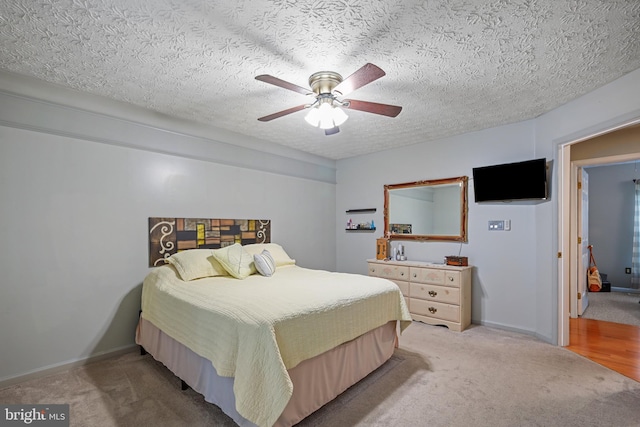 7815 Shallowbrook Ct, Severn, MD 21144 - bedroom with a textured ceiling, a ceiling fan, and light colored carpet