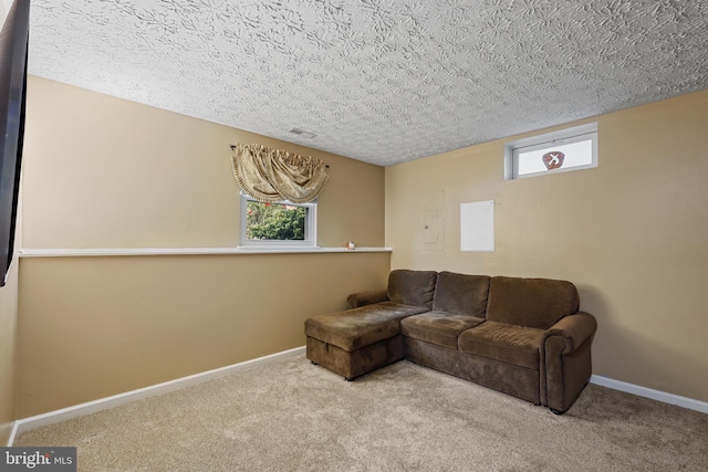 7815 Shallowbrook Ct, Severn, MD 21144 - carpeted living area featuring a textured ceiling, visible vents, and baseboards