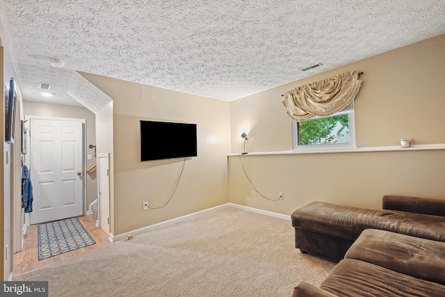 7815 Shallowbrook Ct, Severn, MD 21144 - carpeted living room with baseboards, visible vents, and a textured ceiling