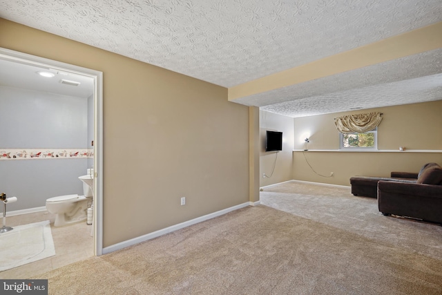 7815 Shallowbrook Ct, Severn, MD 21144 - sitting room featuring a textured ceiling, baseboards, and carpet floors