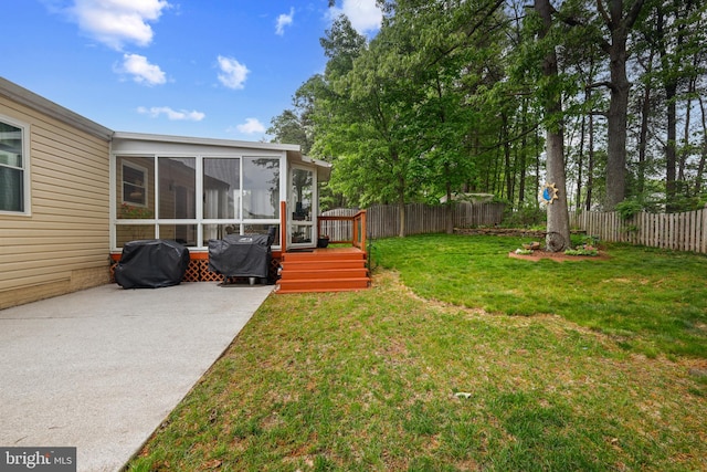 7815 Shallowbrook Ct, Severn, MD 21144 - view of yard featuring a wooden deck, a sunroom, a fenced backyard, and a patio