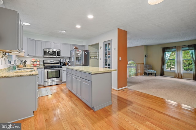 7815 Shallowbrook Ct, Severn, MD 21144 - kitchen with a sink, stainless steel appliances, gray cabinets, light wood-style floors, and recessed lighting