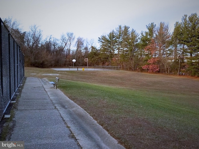 view of grassy yard featuring view of scattered trees
