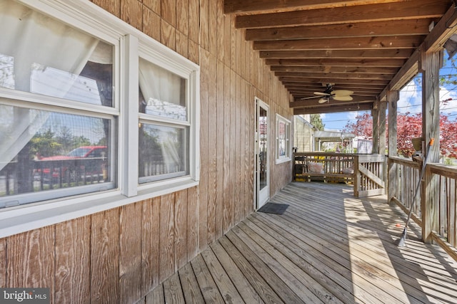 wooden deck with a ceiling fan