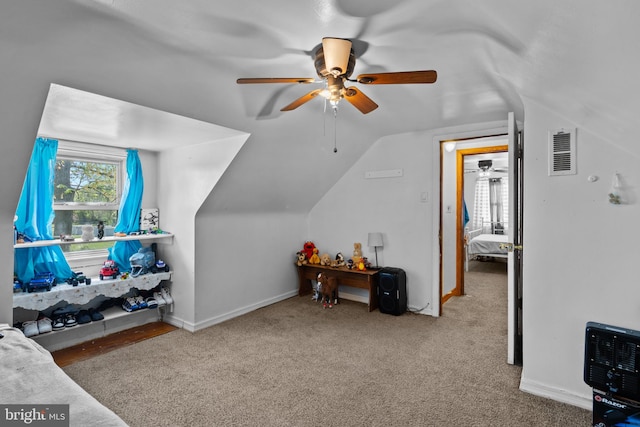 additional living space with ceiling fan, vaulted ceiling, carpet floors, and baseboards