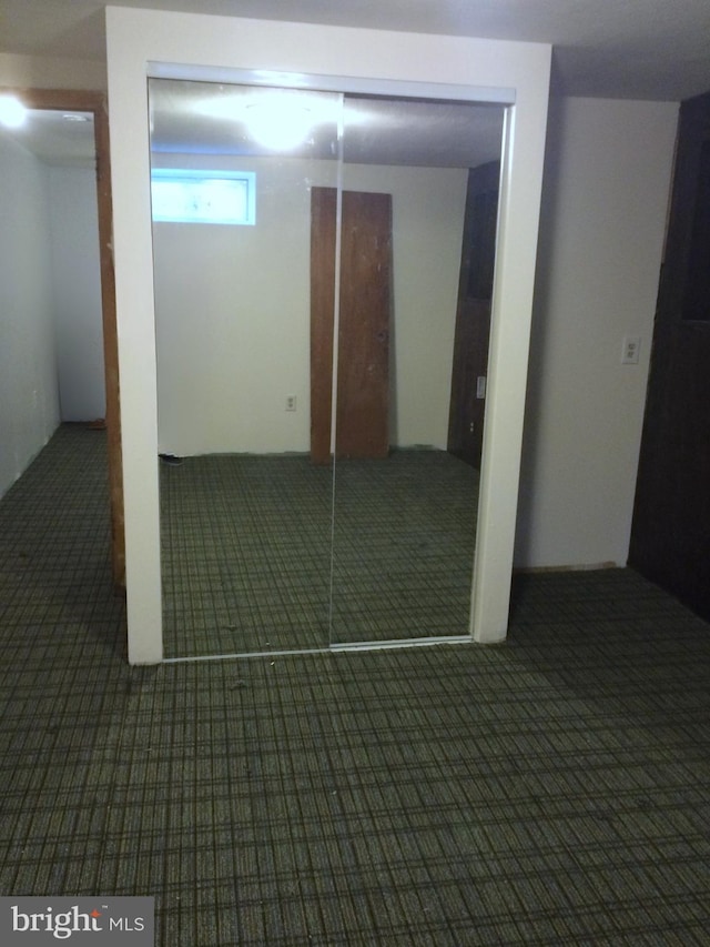 below grade area featuring carpet flooring