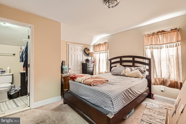 3717 Nortonia Rd, Baltimore, MD 21216 - carpeted bedroom with baseboards, ensuite bath, and vaulted ceiling