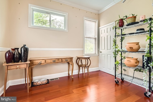 3717 Nortonia Rd, Baltimore, MD 21216 - living area with plenty of natural light, wood finished floors, crown molding, and baseboards