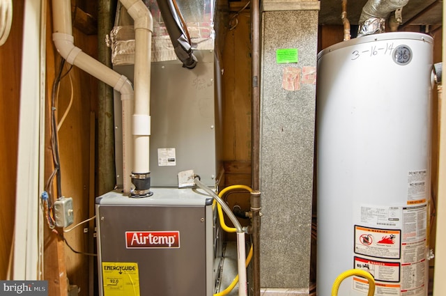 utility room featuring gas water heater