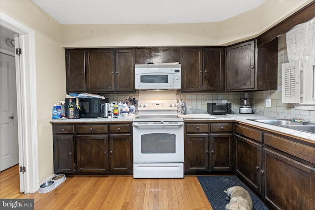 1806 Cranberry Ln, Reston, VA 20191 - kitchen featuring white appliances, light wood-type flooring, and decorative backsplash
