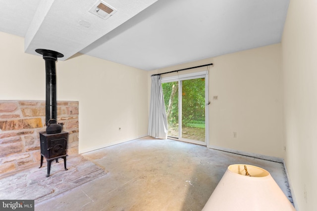 1806 Cranberry Ln, Reston, VA 20191 - unfurnished living room with unfinished concrete floors and a wood stove