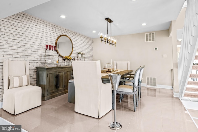 dining space featuring wet bar, visible vents, and light tile patterned floors