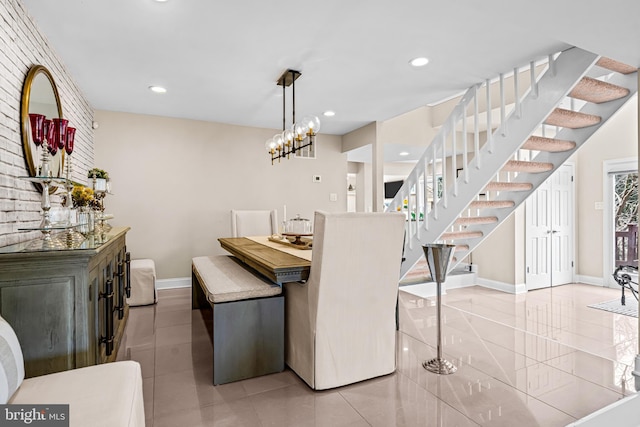 dining space featuring baseboards, recessed lighting, stairs, and light tile patterned floors