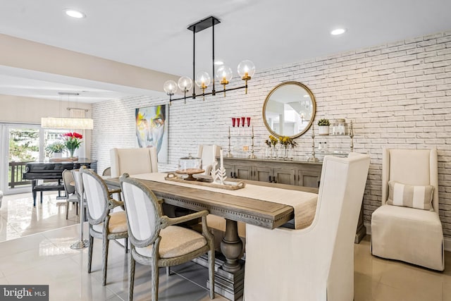 dining room featuring light tile patterned flooring, brick wall, and recessed lighting
