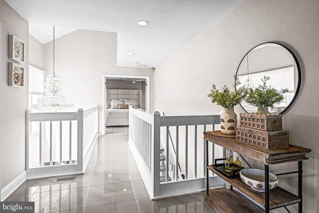 corridor featuring visible vents, an upstairs landing, baseboards, a chandelier, and recessed lighting