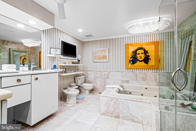 full bathroom with a bidet, vanity, a whirlpool tub, toilet, and wallpapered walls
