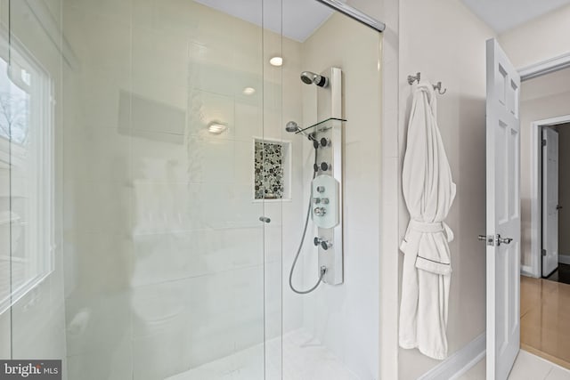 full bathroom featuring a shower stall
