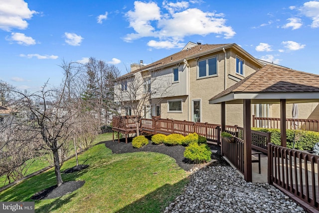 view of yard with a gazebo and a wooden deck