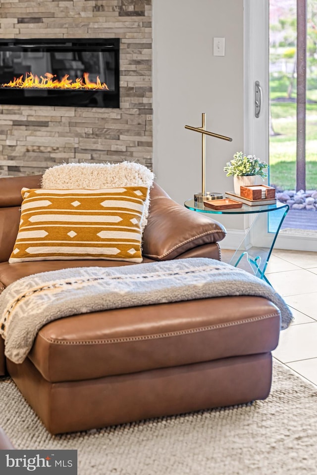 interior space with tile patterned floors and a fireplace