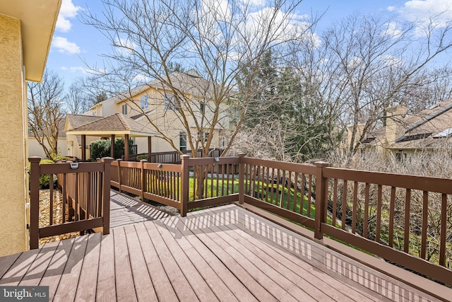wooden deck with a gazebo