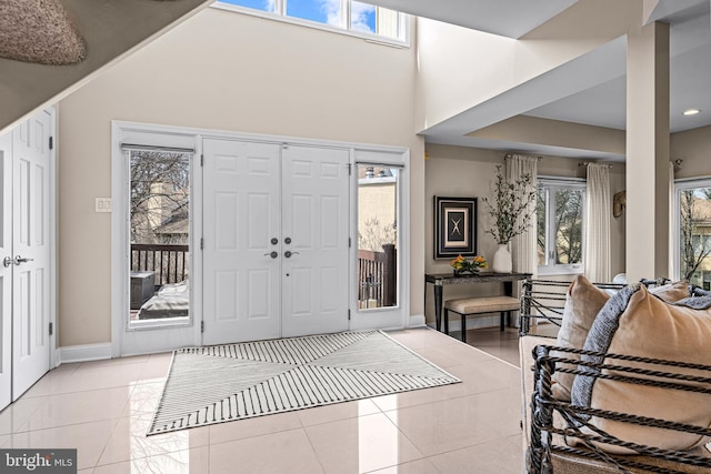 tiled entryway with baseboards
