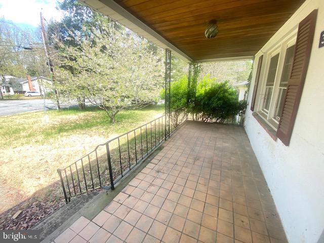 view of patio featuring a porch
