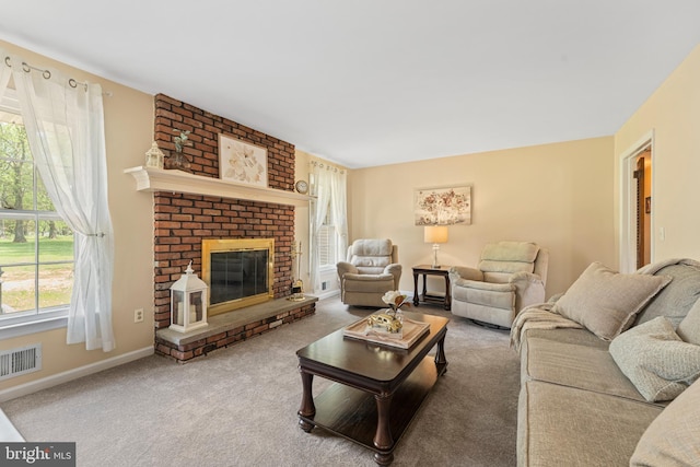 carpeted living area with baseboards, visible vents, and a fireplace