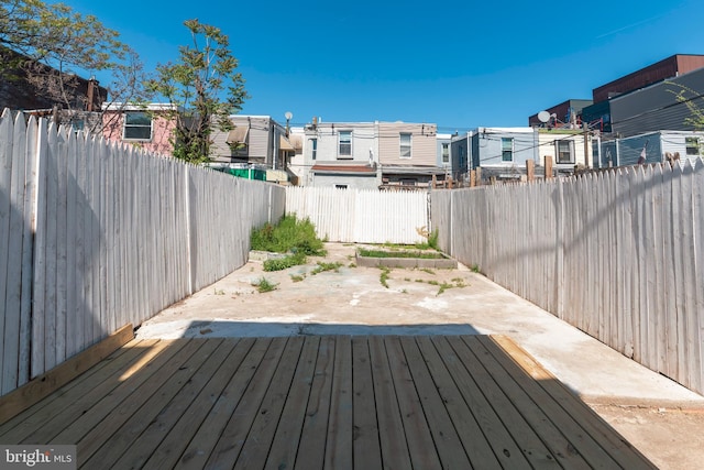 1819 E Sergeant St, Philadelphia, PA 19125 - wooden deck with a residential view, a patio, and a fenced backyard