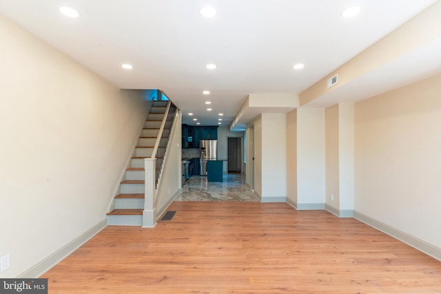 stairs featuring recessed lighting, visible vents, and wood finished floors