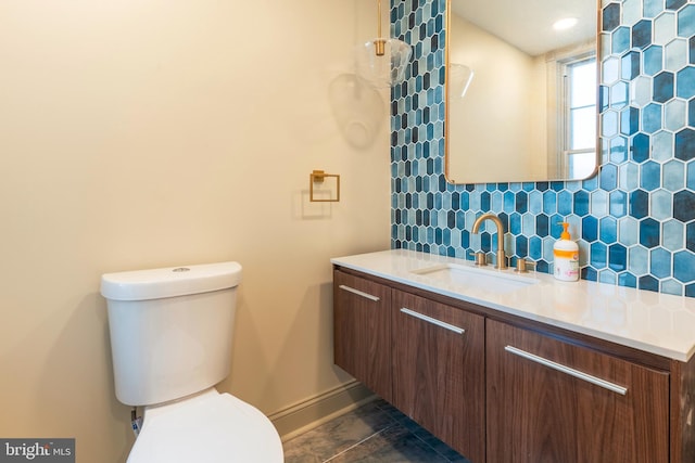 1819 E Sergeant St, Philadelphia, PA 19125 - bathroom with baseboards, tasteful backsplash, vanity, and toilet