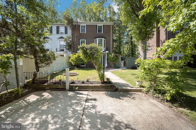 view of property's community featuring fence