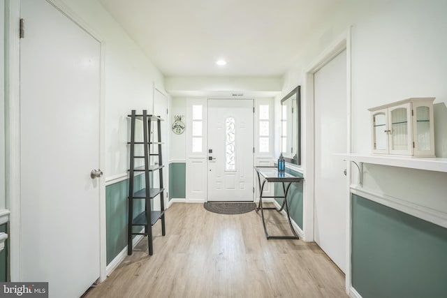 foyer featuring recessed lighting, baseboards, and light wood-style flooring