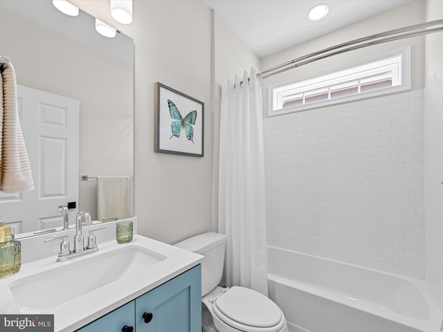 full bathroom featuring plenty of natural light, shower / tub combo with curtain, toilet, and vanity
