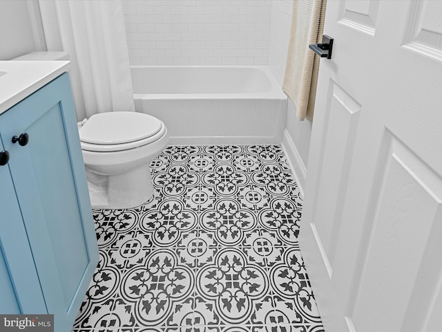 bathroom featuring tile patterned flooring, shower / bathtub combination with curtain, toilet, and vanity