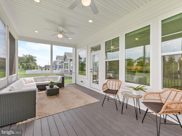 sunroom with an outdoor hangout area and ceiling fan