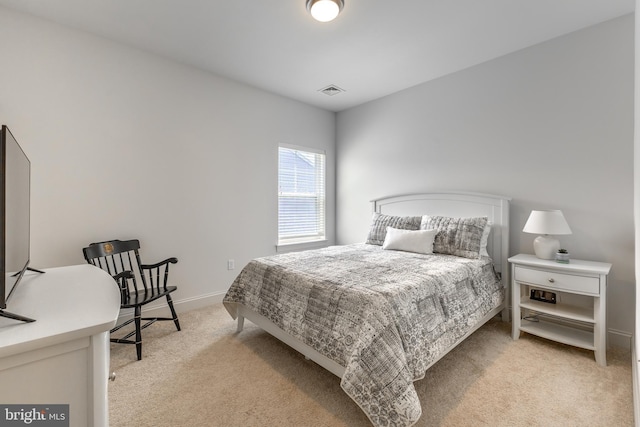 bedroom with baseboards, light colored carpet, and visible vents