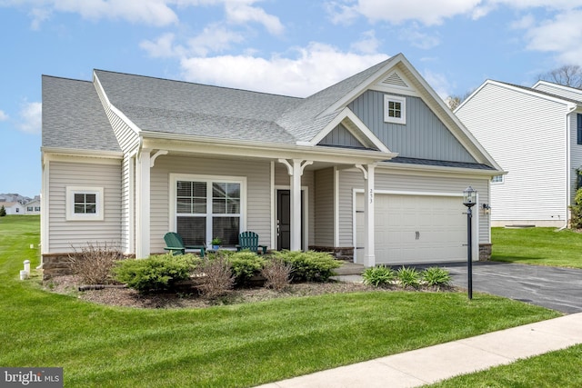 view of front of house with board and batten siding, a shingled roof, a porch, and aphalt driveway