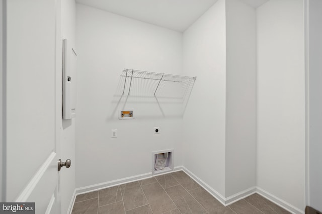 laundry area with baseboards, laundry area, electric dryer hookup, and hookup for a washing machine