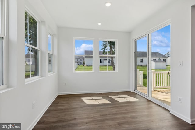 unfurnished sunroom with visible vents
