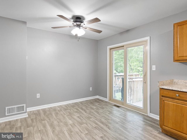 34 Dovetree Dr, Newark, DE 19713 - unfurnished dining area with light wood-style floors, a ceiling fan, and baseboards