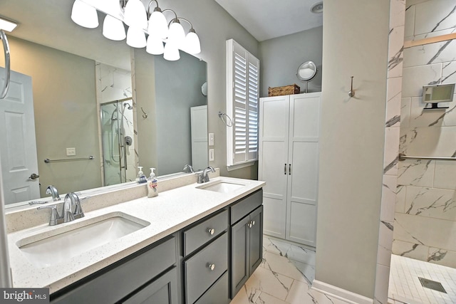 full bathroom featuring double vanity, a marble finish shower, a sink, and marble finish floor